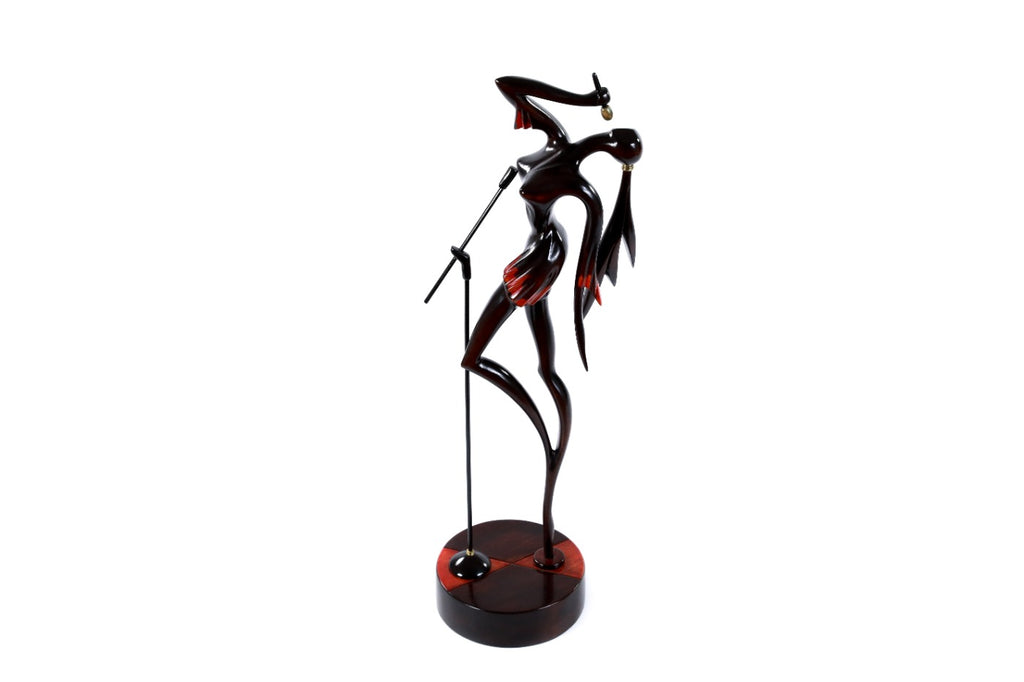 Hand-carved singer figure sculpture — back view