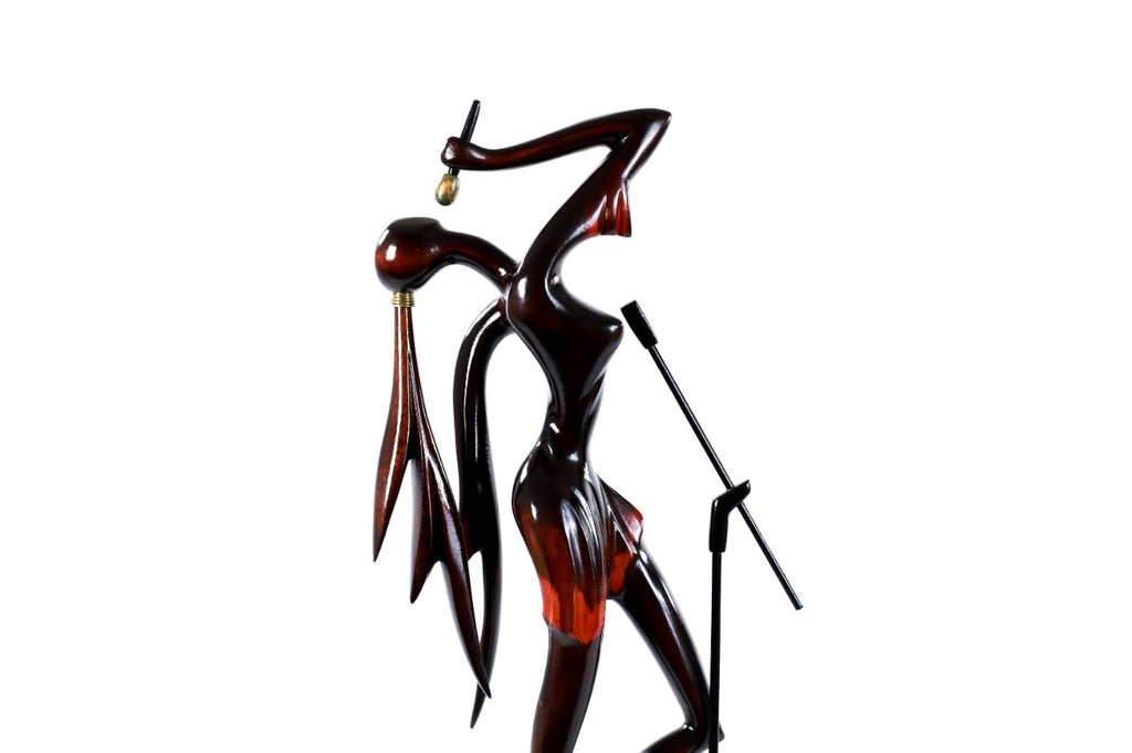 Hand-carved singer sculpture — profile view