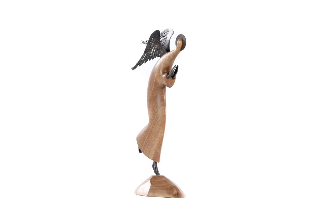 Walnut angel sculpture hand carved with metal pieces — detail view
