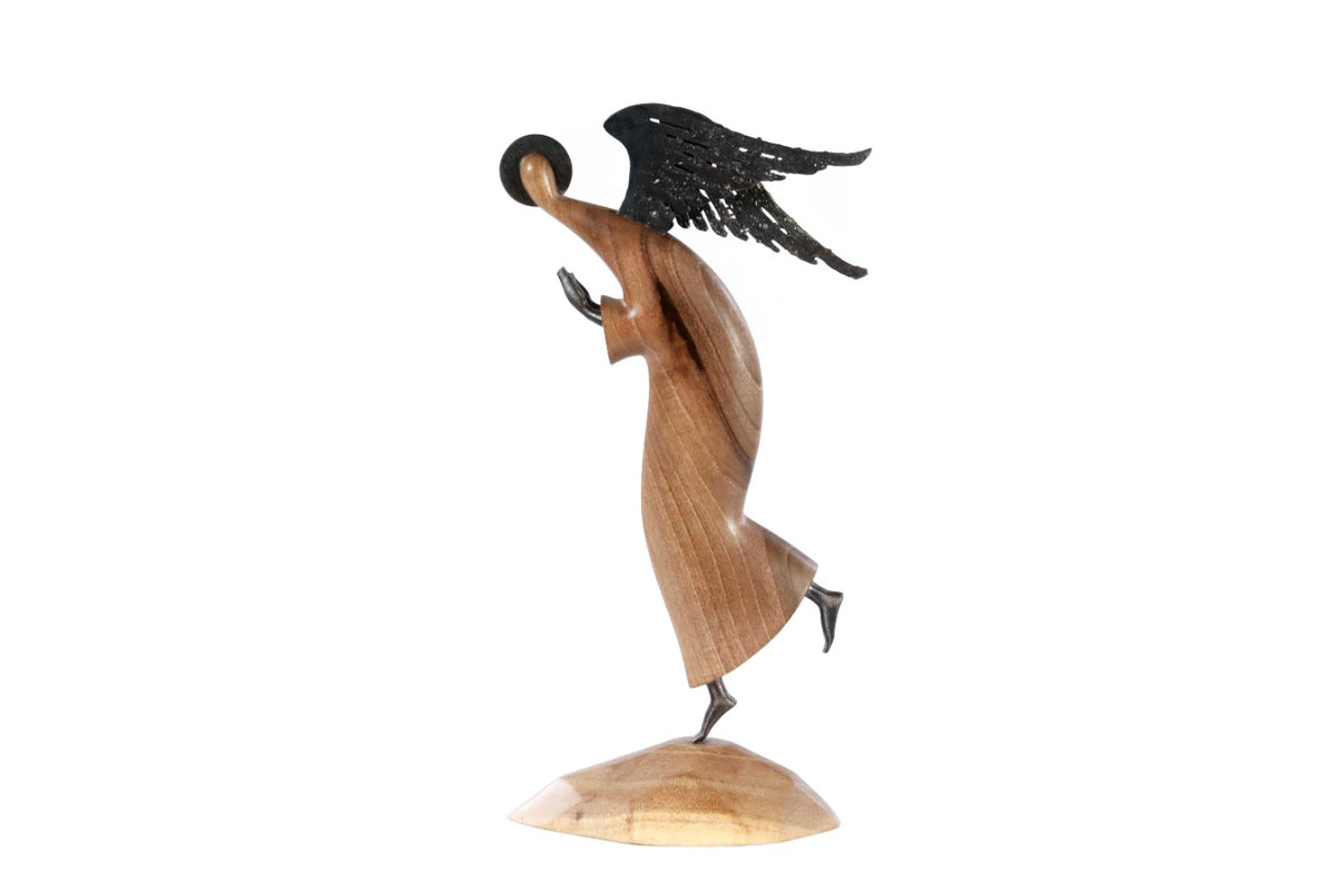 Angel sculpture in carved walnut wood — side view