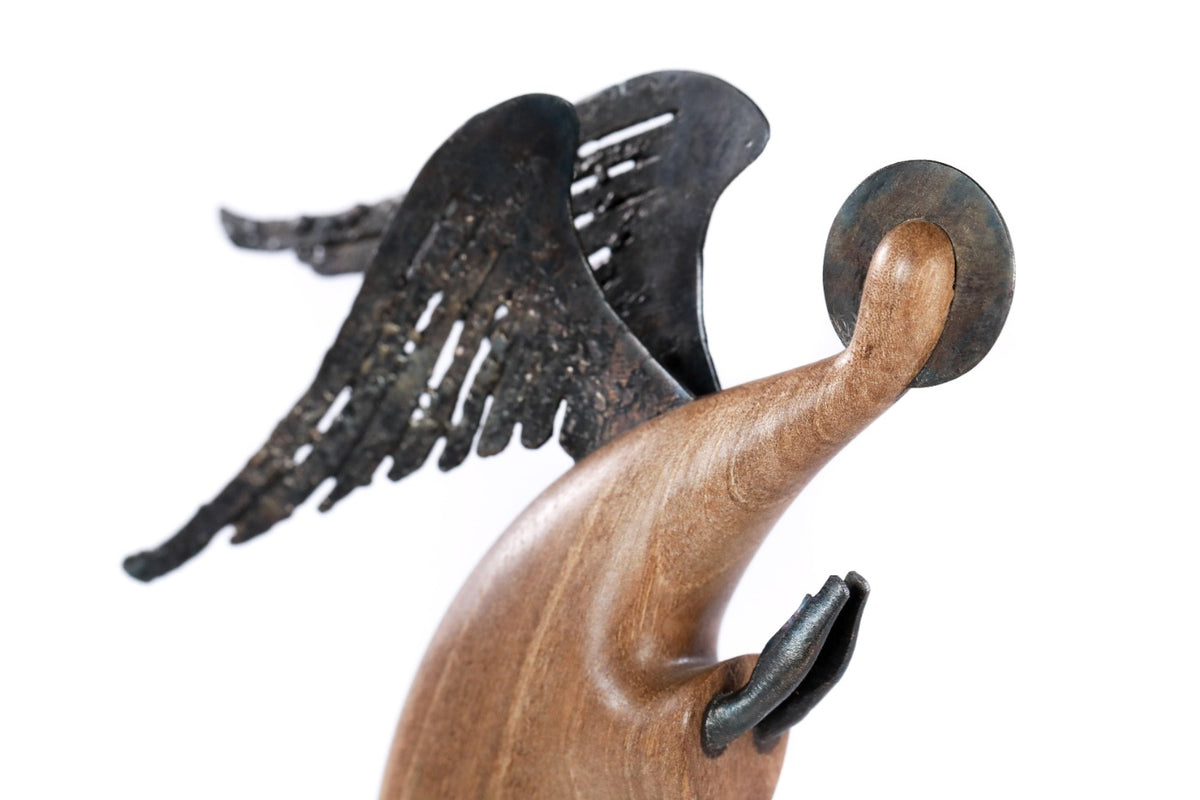 Hand-carved angel sculpture, reverse side view