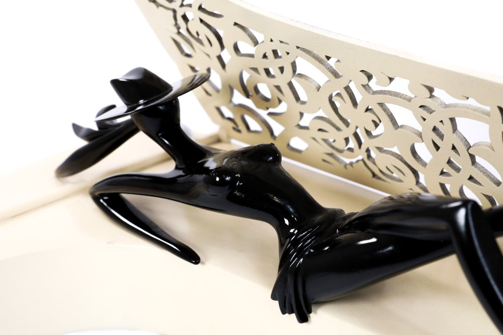 Lady of the Piano sculpture in carved wood — side view