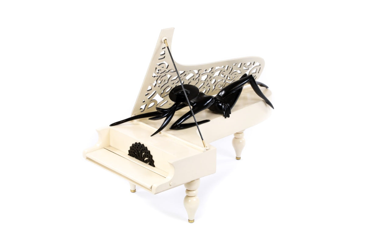 Lady of the Piano sculpture hand carved by Hrachya Ohanyan — angle view