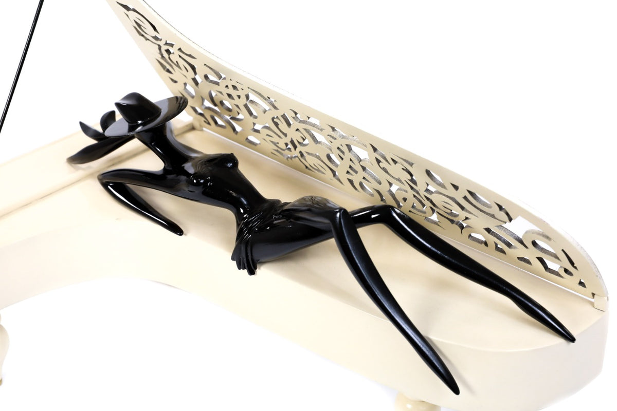 Hand-carved Lady of the Piano sculpture — profile view