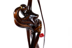 Wooden sculpture of a girl with pomegranates — close-up