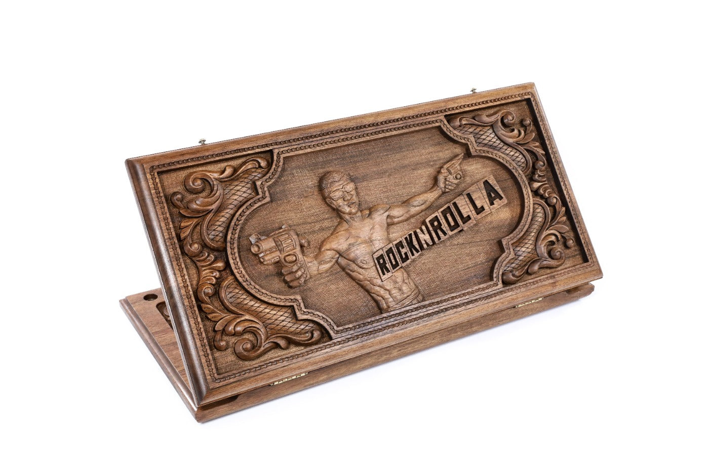 A frontal shot of the closed RocknRolla backgammon board showing the detailed wood incrustation and thematic carving.