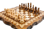 Handmade wooden chess board with decorative ornamental detailing