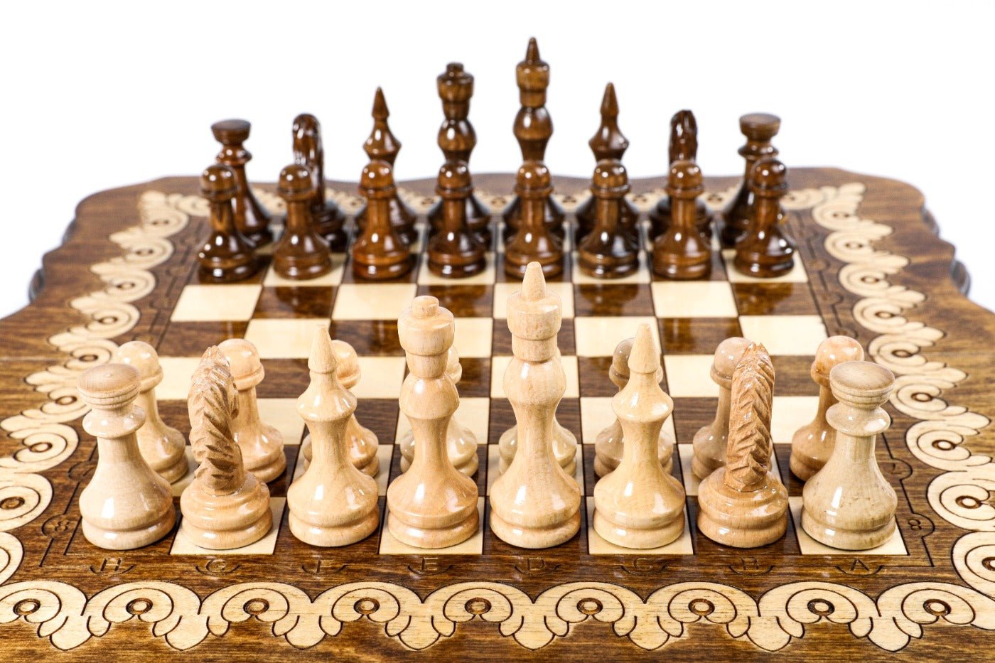 Small handcrafted chess set with elegant pattern design and backgammon board 