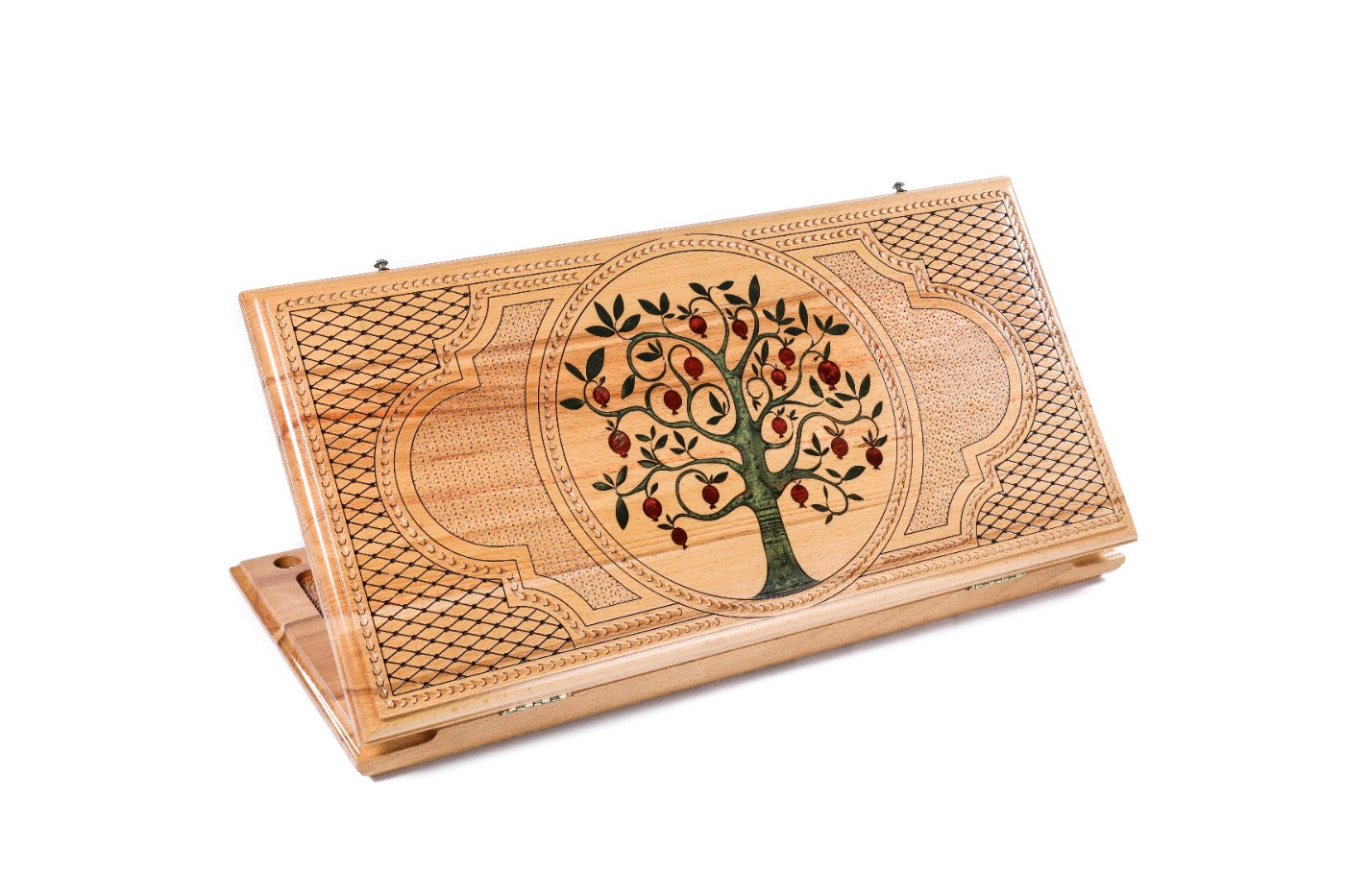 A frontal shot of the closed Pomegranate Tree backgammon board featuring vibrant red epoxy resin and high-relief wood carving.
