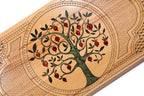 An angled view of the Hrachya Ohanyan board showing the glossy ruby resin against the natural solid wood grain.
