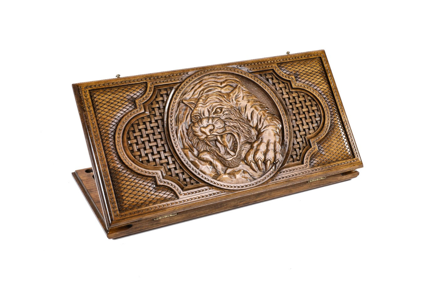 A frontal shot of the closed Tiger backgammon board showing the complex, multi-layered 3D relief carving.