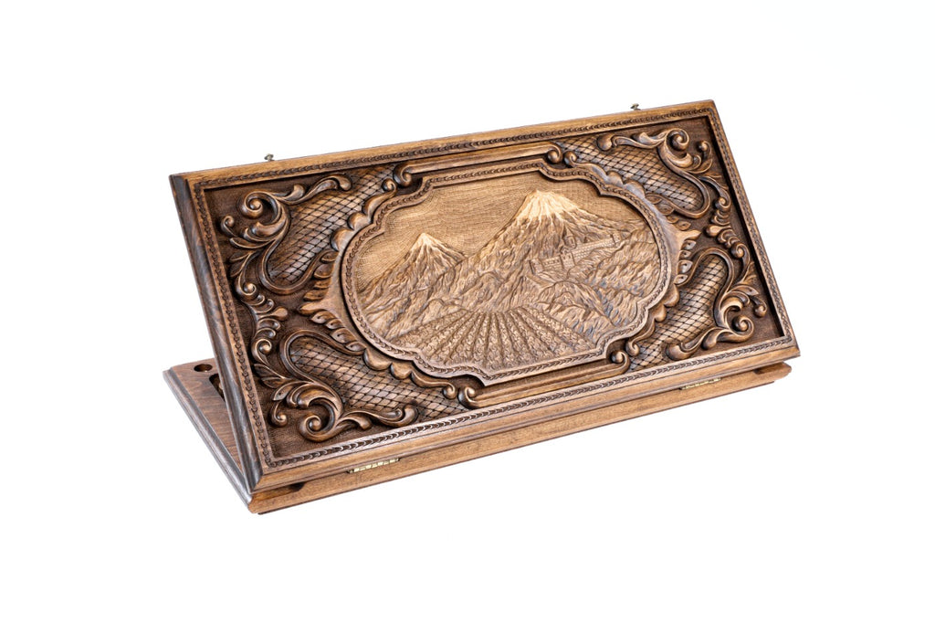 A frontal shot of the closed Ararat backgammon board showing the complex, multi-layered mountain and forest relief.
