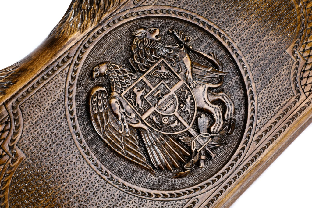 An angled view of the Hrachya Ohanyan Armenian emblem board highlighting the depth of the 3D wood carvings and mountain-shaped edges.
