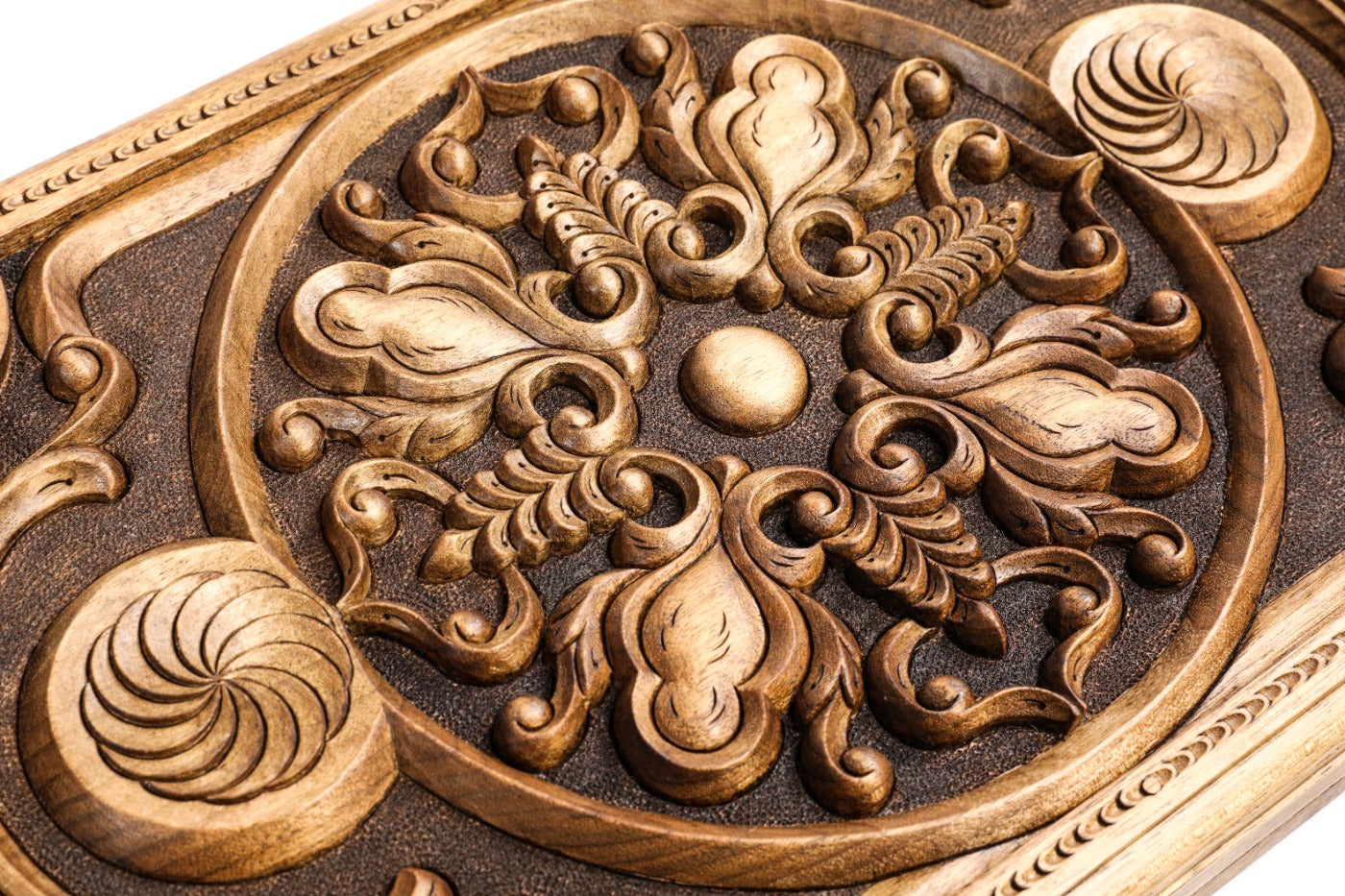 Frontal shot showing the two-sided hand-carved Eternity symbol on the solid wood exterior.