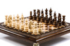 Handmade wooden chess set elevated on bronze legs