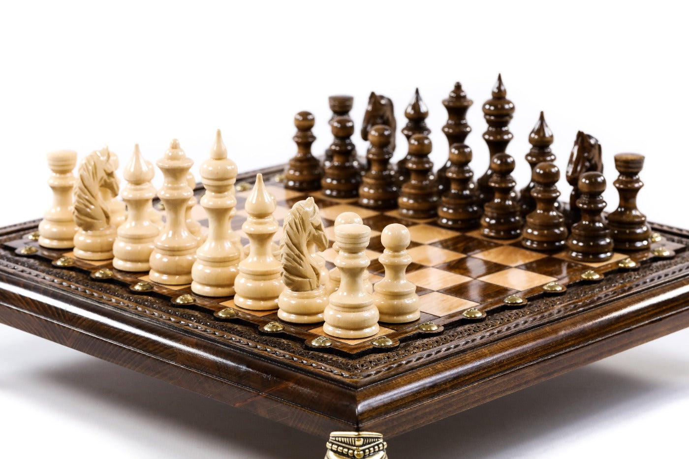 luxury wooden chess set elevated on bronze legs