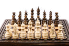 Wooden chess set with bronze legs in a modern square design
