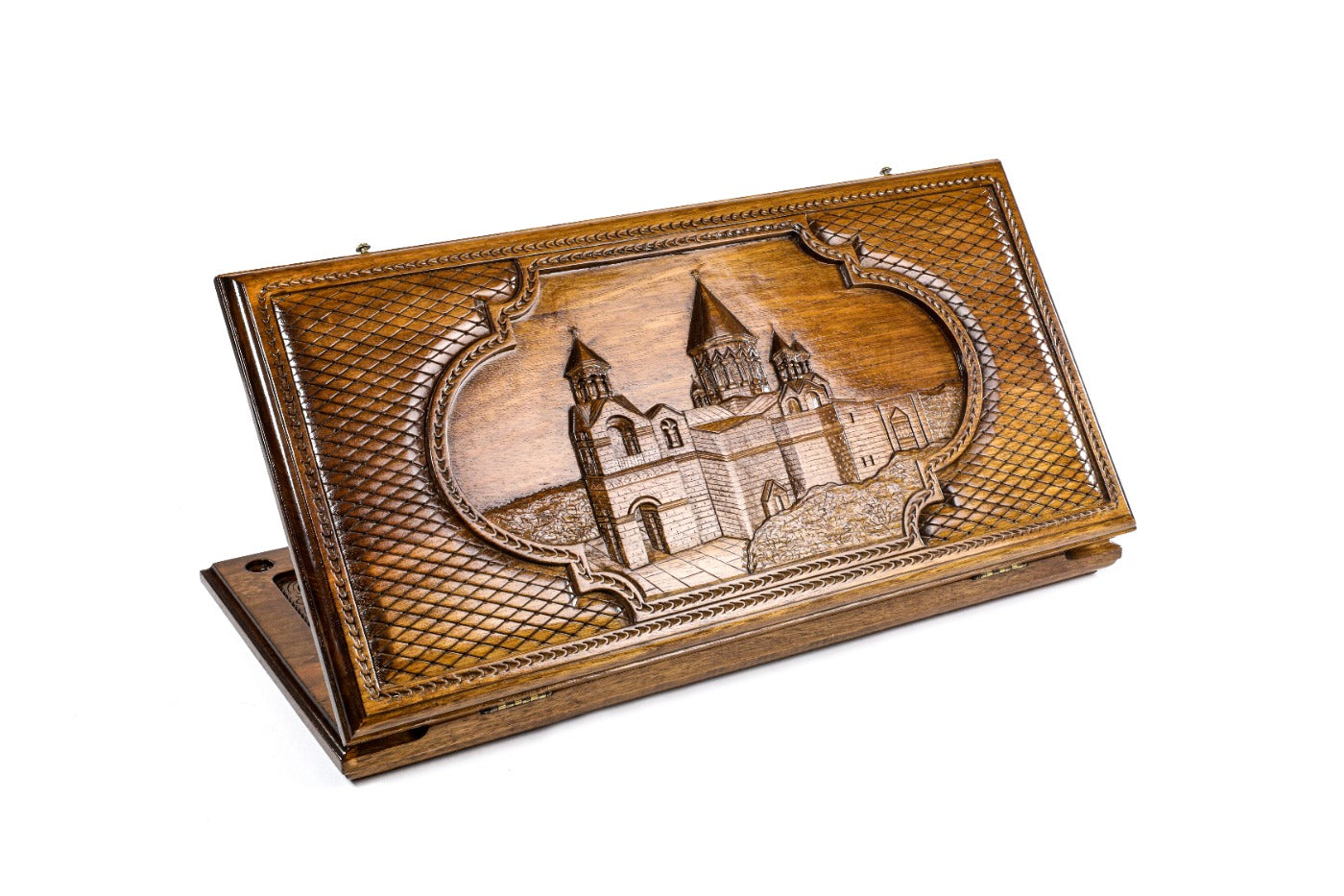 A frontal shot of the closed Etchmiadzin classic backgammon board showcasing the detailed cathedral relief carving.