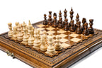wooden chess board with detailed carved pieces