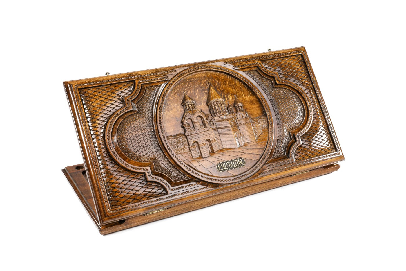 A frontal shot of the closed Etchmiatsin backgammon board by Hrachya Ohanyan showing the detailed cathedral carving.