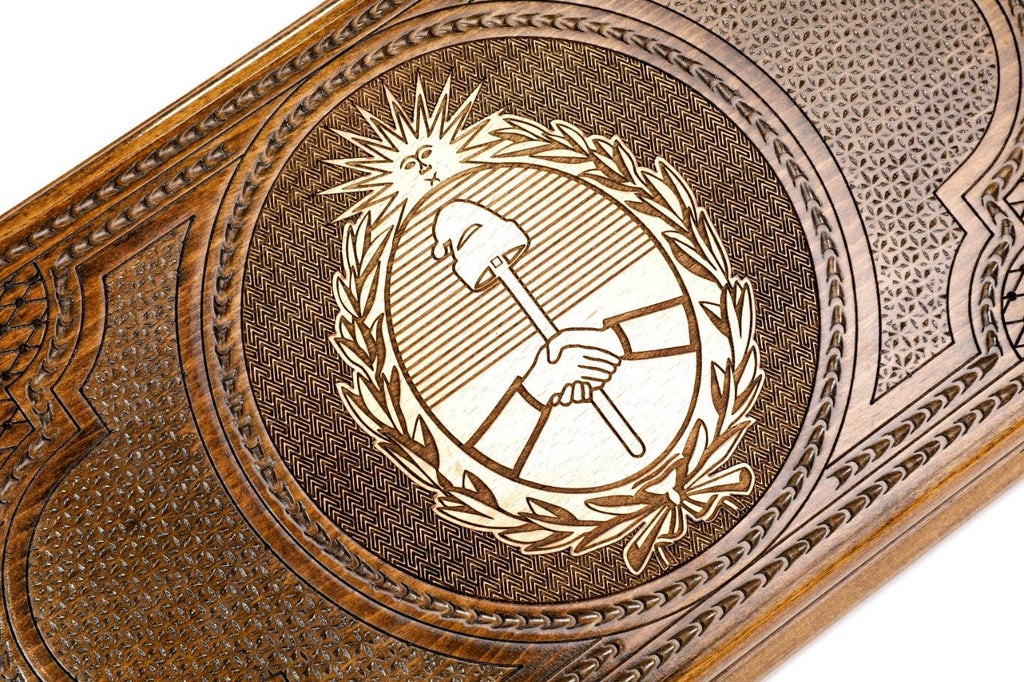 Frontal view of the hand-carved Argentine crest on the solid wood exterior.
