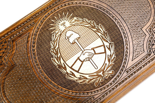 Frontal view of the hand-carved Argentine crest on the solid wood exterior.