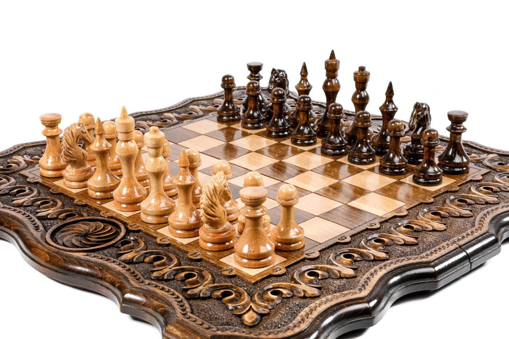 Wooden chess board featuring detailed decorative ornamental craftsmanship