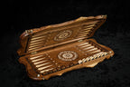 Walnut backgammon board opened flat, pale inlaid points and wheel ornaments on each half
