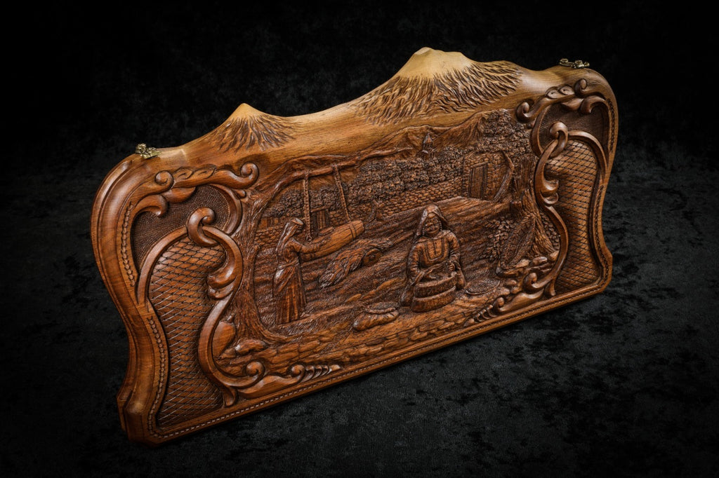 Village hand mill backgammon set closed, front view of the carved scene in its rococo scroll frame