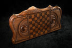 Back cover of the village backgammon set: basket-weave chequerboard between eternity whirls in deep relief
