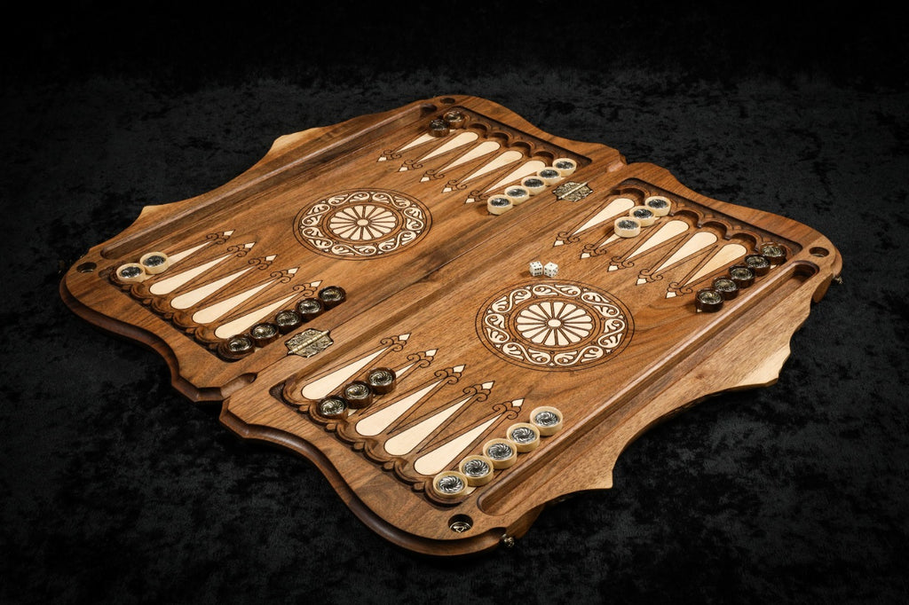 Walnut backgammon set open with hornbeam-inlaid points, checkers and dice on the 60 cm board, angled view