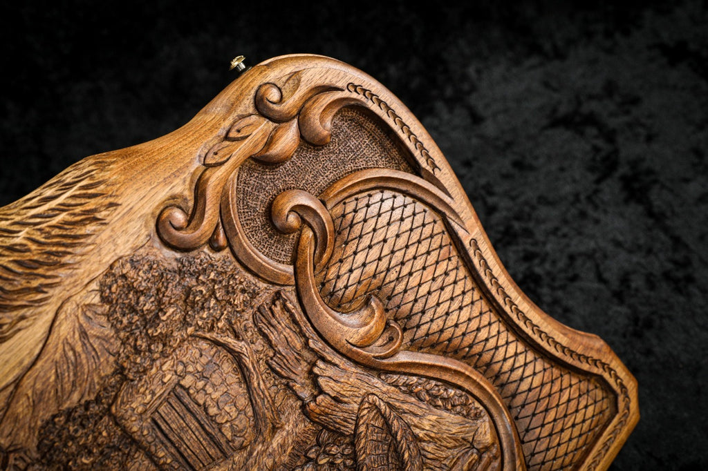 Corner of the lid: rococo scroll, faceted lattice and the carved slope of the Ararat peaks