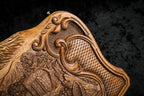Corner of the lid: rococo scroll, faceted lattice and the carved slope of the Ararat peaks