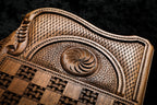 Eternity whirl in deep relief on the back cover beside the basket-weave chequerboard