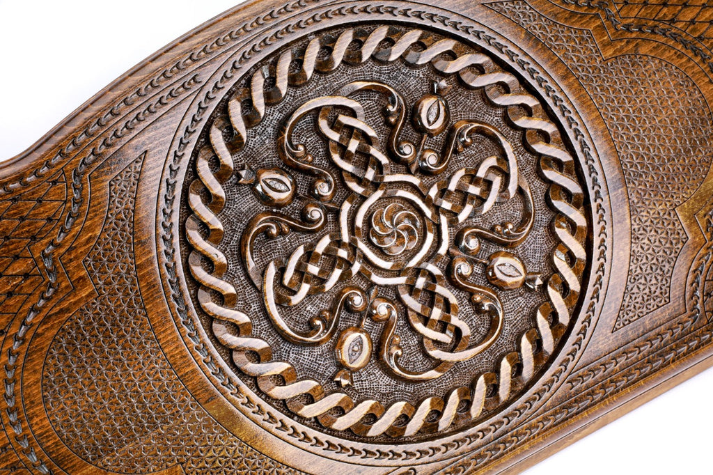 The interior of the open Hrachya Ohanyan pomegranate set showing the rich wood grain and the professional playing surface.
