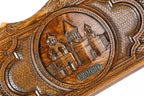 The open interior of the Armenian backgammon set showing the rich wood grain and the precisely inlaid triangular points.