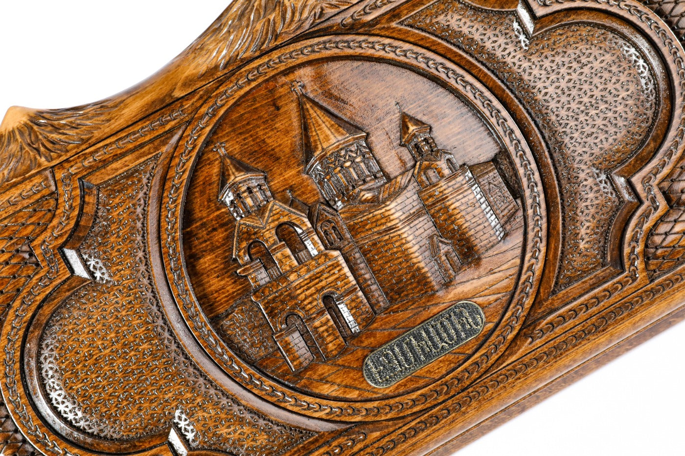 The open interior of the Armenian backgammon set showing the rich wood grain and the precisely inlaid triangular points.