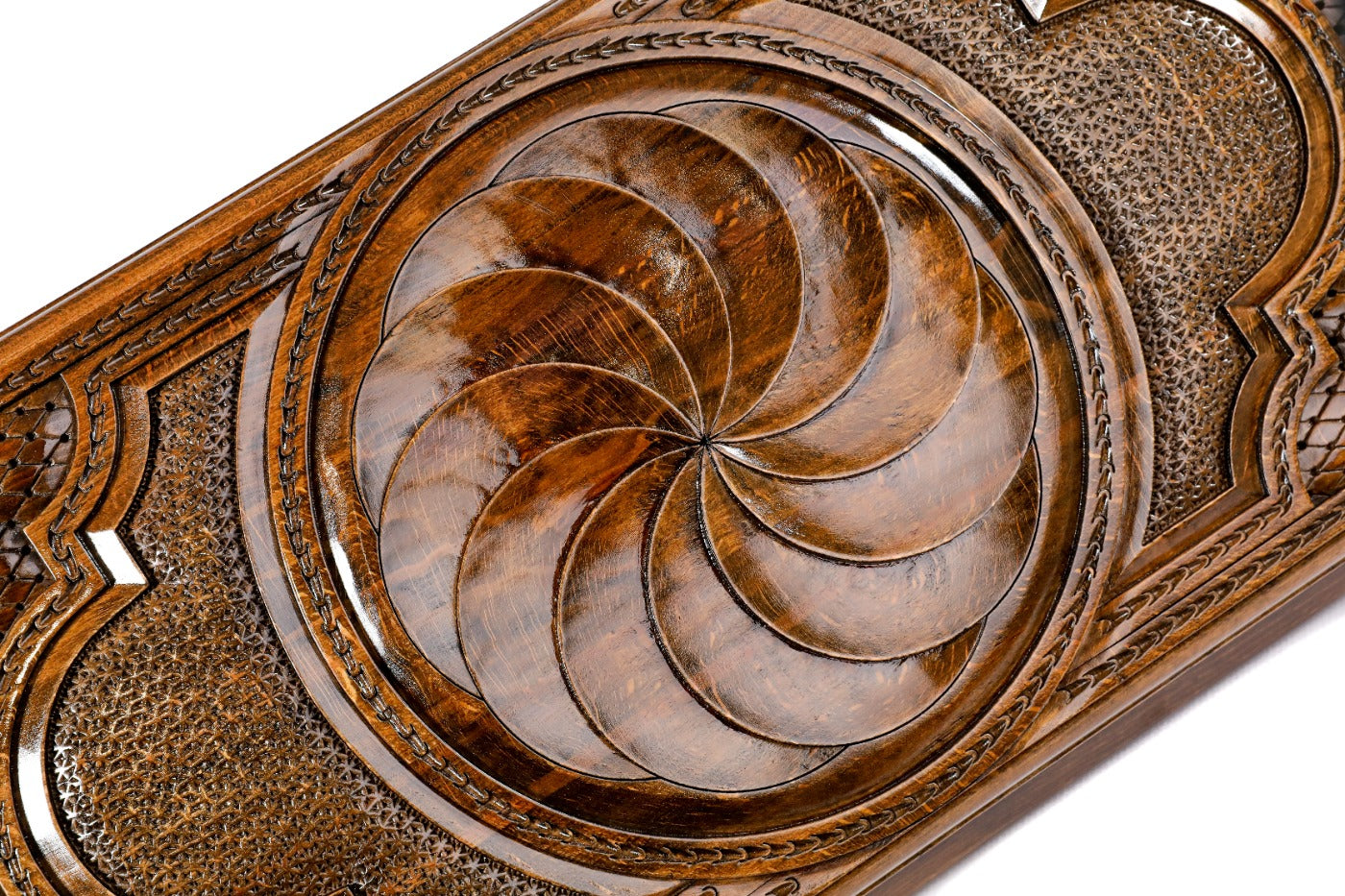 The interior of the open wooden backgammon board highlighting the smooth, polished surface and contrasting pips.