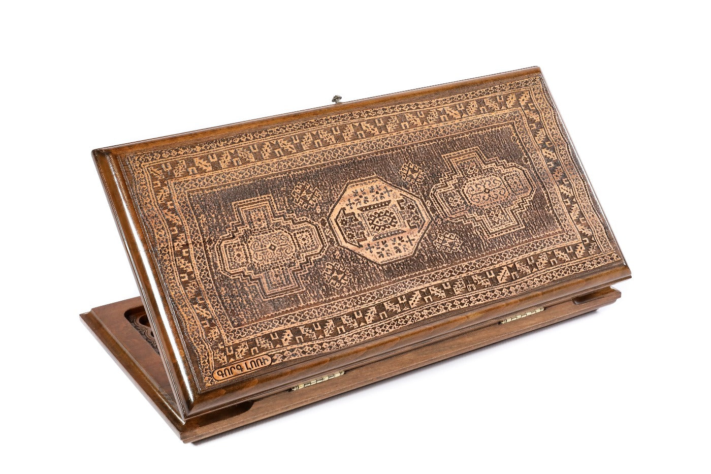 A frontal shot of the closed Carpet Lori backgammon board by Hrachya Ohanyan showing the detailed geometric rug carvings.