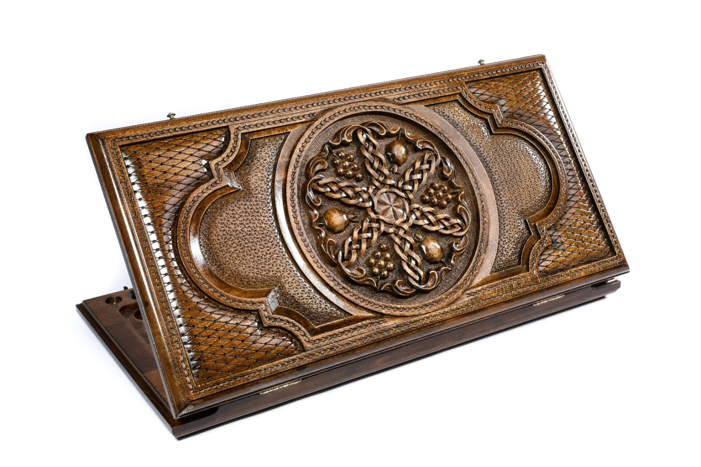 Frontal view of the closed Pomegranate and Grapes backgammon board by Hrachya Ohanyan showing the detailed relief carving.