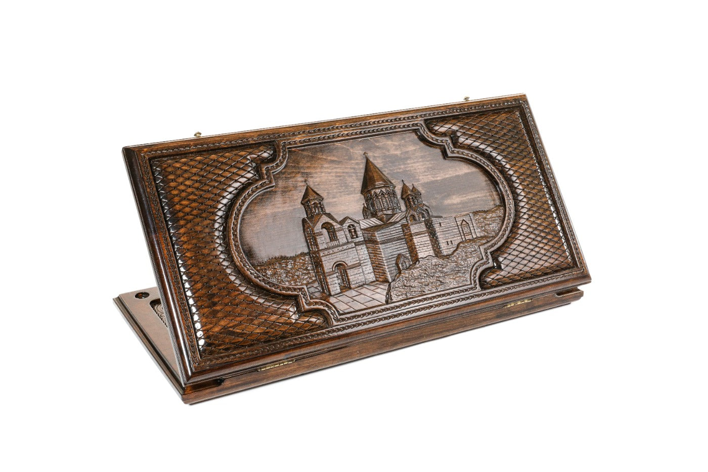 A frontal shot of the closed Etchmiatsin backgammon board by Hrachya Ohanyan showing the detailed cathedral carving.