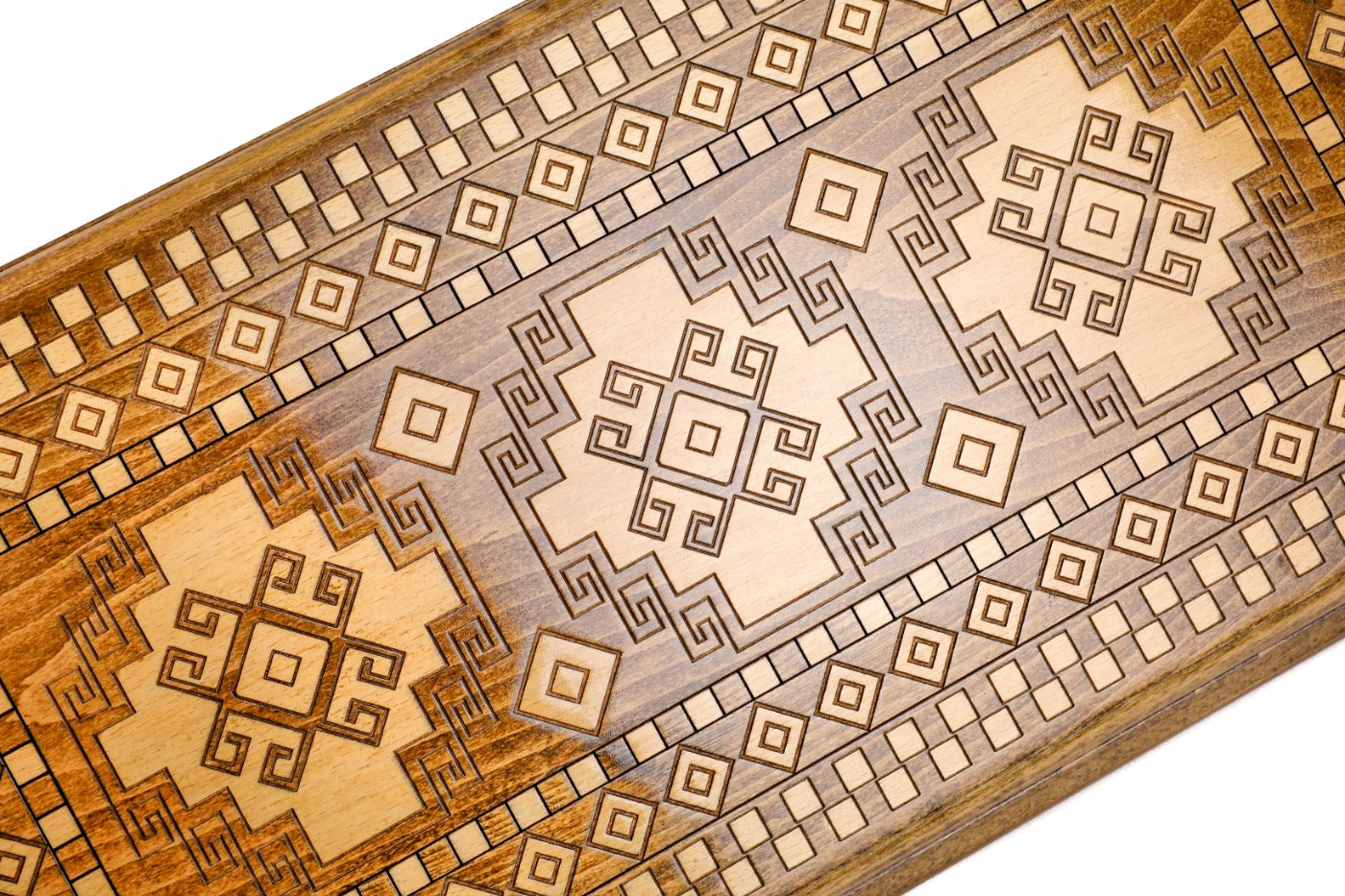 Frontal view of the traditional rug motif relief on the solid wood exterior.