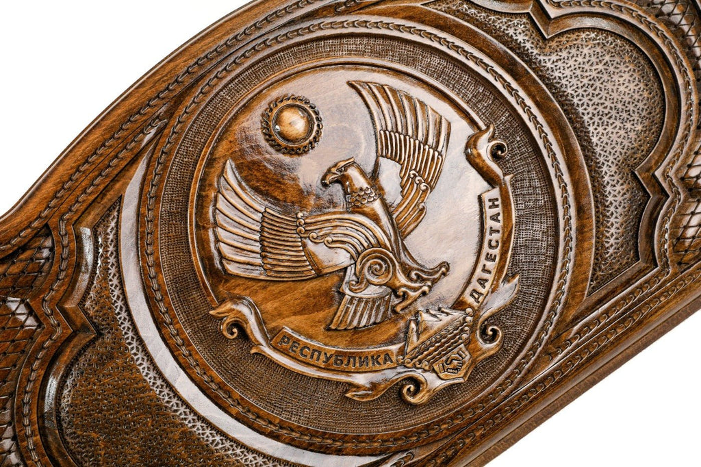 Detail view of the hand-carved Dagestan emblem on the solid wood exterior.