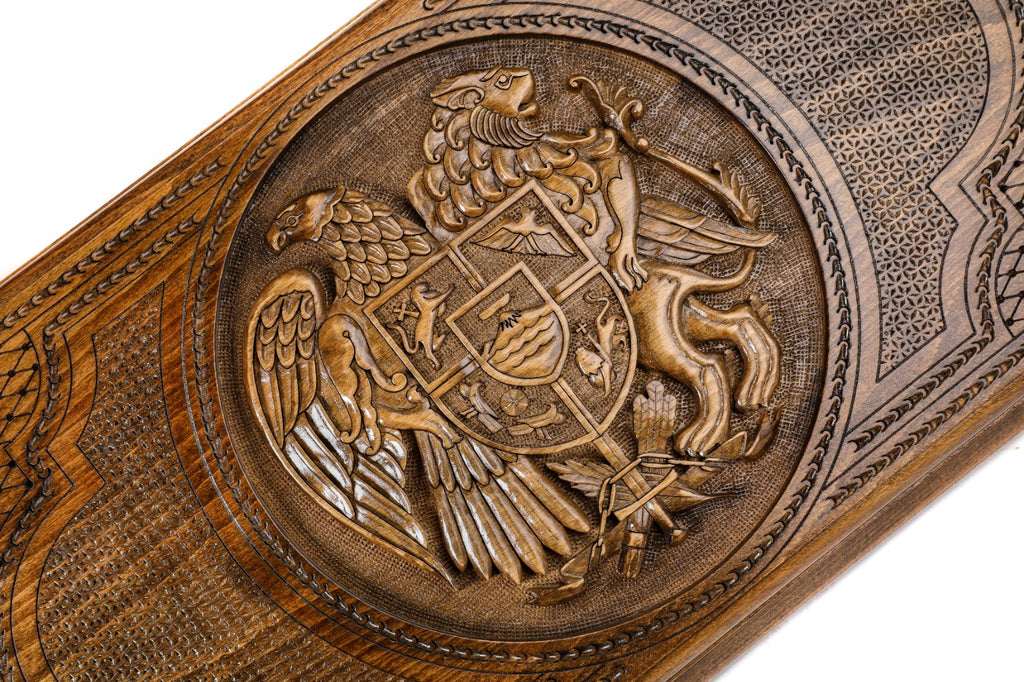 The interior of the open wooden backgammon board highlighting the smooth, polished playing field and pips.