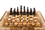 Small handcrafted chess set with ornamental pattern and integrated backgammon board
