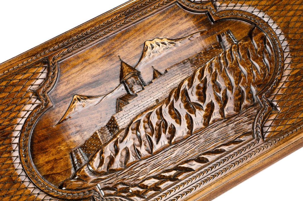 The interior of the open backgammon set showing the rich wood grain and the professional-grade playing surface.