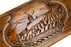 The interior of the open backgammon set showing the rich wood grain and the professional-grade playing surface.