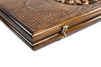 Ornamental backgammon board - playing pieces and dice arranged on the board