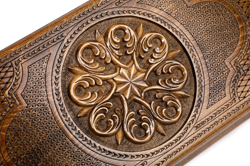Frontal view of the detailed floral ornamental relief on the solid wood exterior.