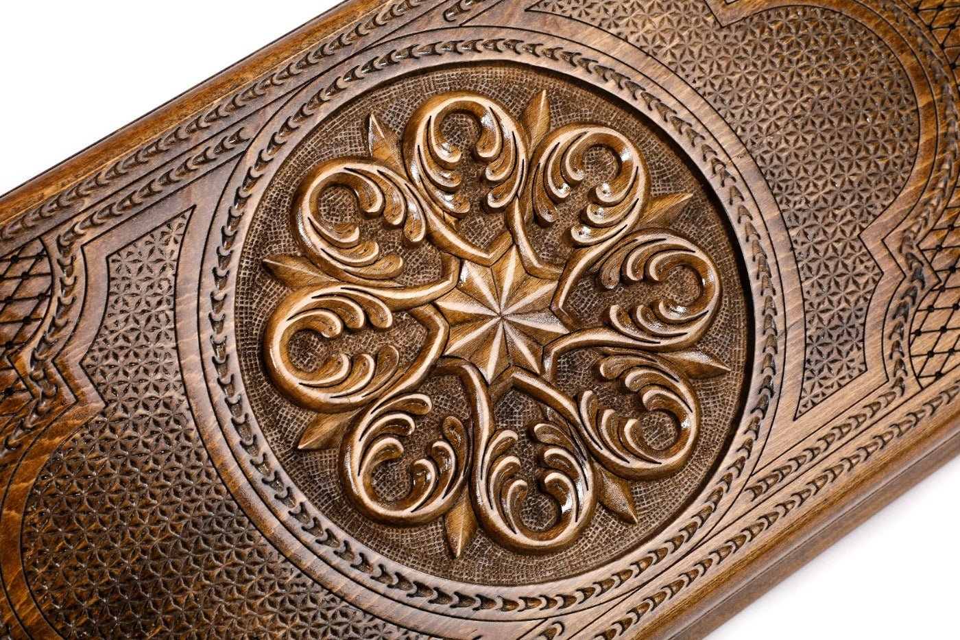 Frontal view of the detailed floral ornamental relief on the solid wood exterior.